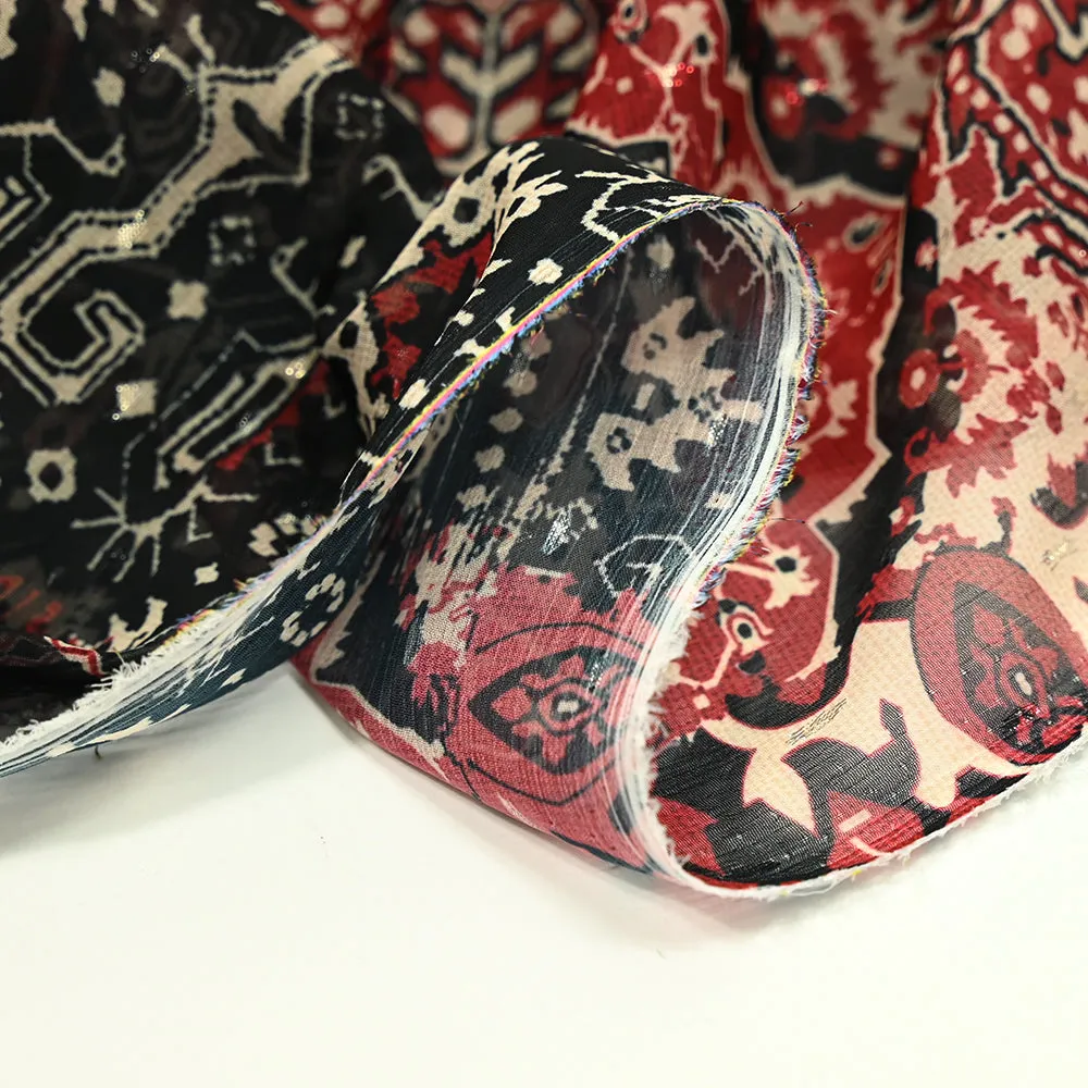Mousseline imprimée plumetis lurex ornement rouge fond noir